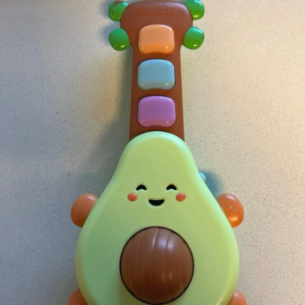 Used Skip Hop Avocado Guitar